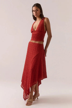 Aaila Lace Top – Blood Orange by Sovere, fitted plunge-neck stretch lace top with side gathers. Perfect for layering or nights out.