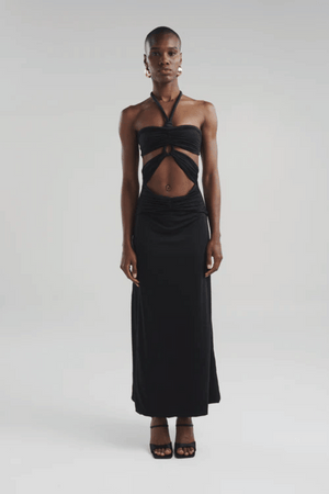 Migramah Black by Maygel Coronel – Draped dress with handmade knot, waist cutout, and shirred hips for flattering fit.