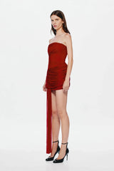 Ember Wrapped Mini Dress by MISHA — a strapless red mini with soft draping and a dramatic floor-length sash, perfect for evening events.