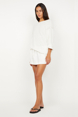 Dante Mini Skirt in Ivory by Bec + Bridge, stretch nylon mini with drawstring waist and gathered finish. Perfect for easy everyday styling.