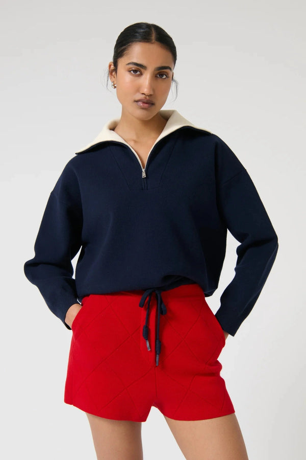 Onte Nerea Sweater in navy and ivory with half zip, two-tone collar, drawstring waist, and relaxed oversized fit.