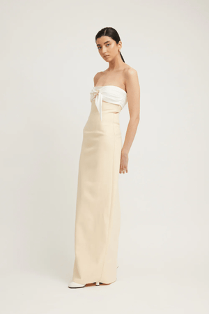 Kasai Dress Lemon/Ivory by Tojhà – A chic strapless maxi with structured bonded fabric, signature buckle detail, and princess seams, perfect for sophisticated events.