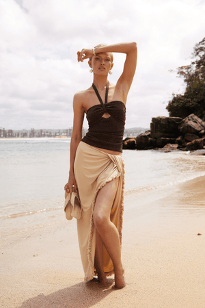 Bernie Fringe Skirt Butter by Benni — Midi skirt with mid-rise waist, front knot, side split, and fringe trim. Made from soft, comfortable jersey fabric.