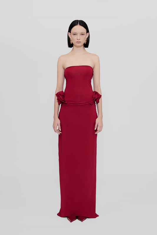 Calliope Dress Carmesi by Maygel Coronel – Strapless maxi dress with waist ruffles in iconic stretch fabric; bold, sleek, and sun-ready.