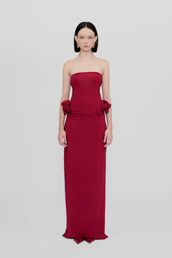 Calliope Dress Carmesi by Maygel Coronel – Strapless maxi dress with waist ruffles in iconic stretch fabric; bold, sleek, and sun-ready.