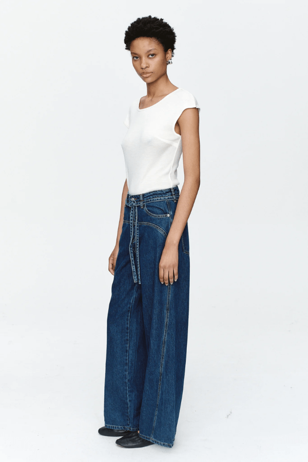 Tie Curve Seam Jean Heritage Blue by Marle, trendy mid-rise jeans with unique curved seam detailing and a relaxed, wide-leg fit. Perfect for a versatile, polished look with a detachable tie belt.