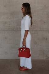 Lefka Midi Dress White by Sneaky Link – Breezy 100% linen midi with button-front and flattering tucks. Perfect for trendy summer strolls or viral lunch dates.
