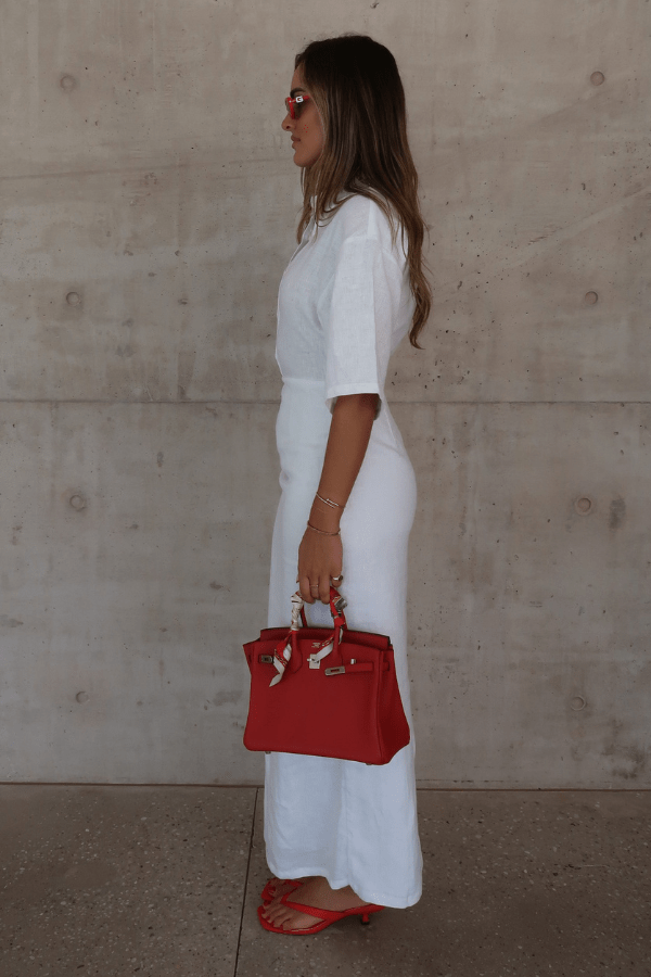 Lefka Midi Dress White by Sneaky Link – Breezy 100% linen midi with button-front and flattering tucks. Perfect for trendy summer strolls or viral lunch dates.