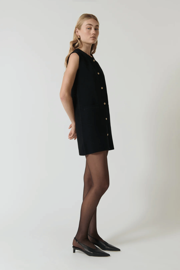 Nanda Dress Black by Onte – A Milano knit mini with gold buttons and A-line fit, designed for sleek, structured wear
