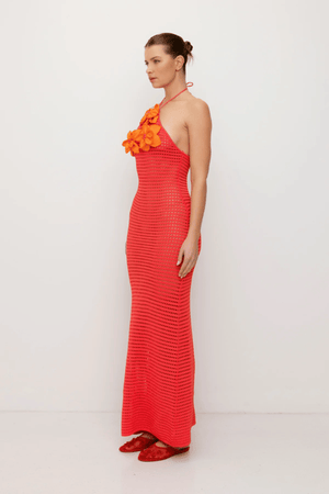 La Monada Knit Maxi Dress Coral by The Wolf Gang – A trendy one-shoulder knit maxi with bold cut-out, thigh-high split, and sculpted fit, perfect for casual or chic occasions.