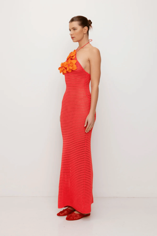 La Monada Knit Maxi Dress Coral by The Wolf Gang – A trendy one-shoulder knit maxi with bold cut-out, thigh-high split, and sculpted fit, perfect for casual or chic occasions.