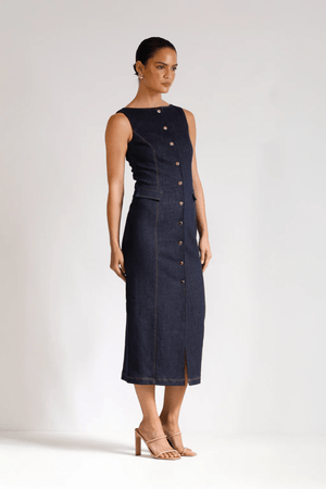 Good Vibes Midi Indigo by Pasduchas – Trendy stretch denim midi with contrast stitching, gold snaps, and tailored pockets, perfect for sleek day-to-night style.
