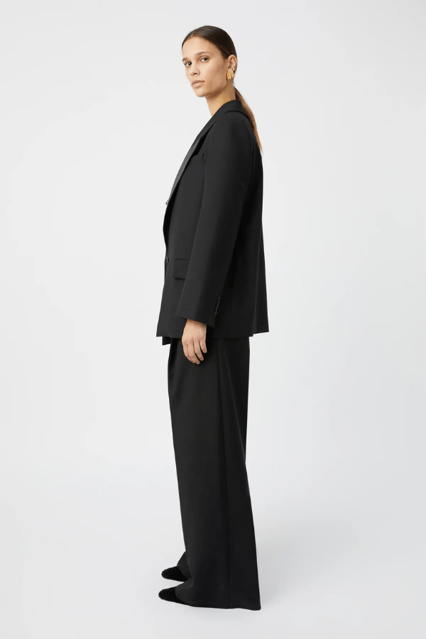 Natalini Blazer Black by Camilla and Marc – Elegant blazer crafted from luxurious Australian wool with sleek satin lapels, forward-rolling shoulders, and a raised swinging back hem.