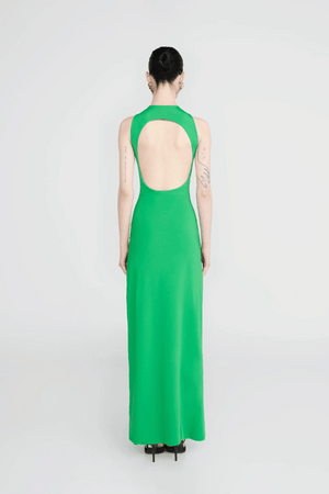 Tirso Spring Green by Maygel Coronel – Long dress with round neck, open back, ruched sash, and 3D flowers for elegant look.