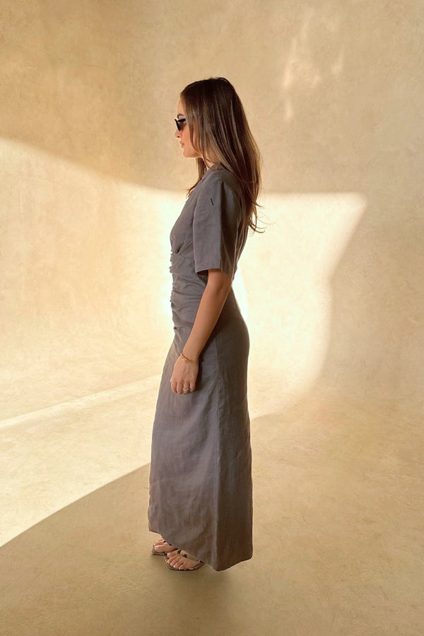 Belle Midi Dress in Steel by Sneaky Link, crafted from breathable linen with ruched shaping and arm coverage. Perfect for warm-weather elegance.

