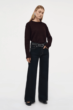 Eva Wide Cannes Dark Indigo by Neuw Denim, trendy tailored wide-leg jeans with a fitted mid-rise waist and A-line cut. Perfect for a feminine, laid-back look in dark indigo denim with subtle fading and contrast tobacco stitching.