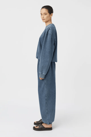 Dovell Crew Indigo by Camilla and Marc, denim fleece with saddle stitching and adjustable hem, perfect for casual days or trendy streetwear layering.