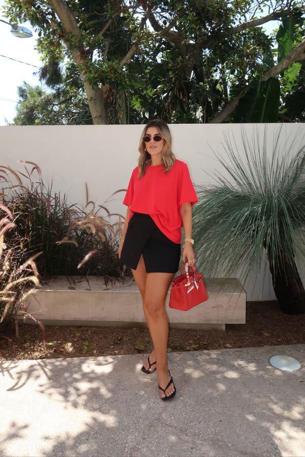 Sneaky Mini Skirt Black by Sneaky Link – A-line high-waisted mini with boned waist and flap pockets, perfect for day-to-night styling.