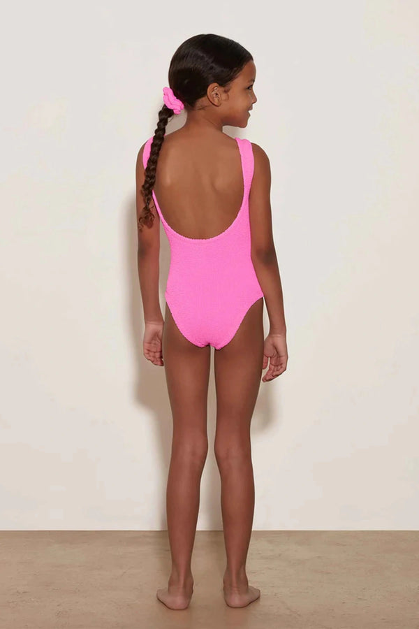 Classic Swim in Bubblegum by Hunza G, a soft crinkle one-piece for ages 3–6. Perfect for twirls, beach days, and playful adventures.