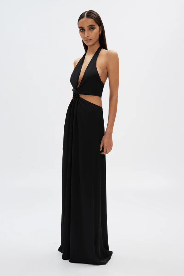 The Wander Satin Gown Black by Misha – A timeless, elegant maxi gown in lightweight satin with a flattering twisted front detail, perfect for warm evening events.