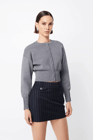 Manhattan Cardigan Pale Grey by Mossman – Relaxed fit crepe knit with round neck, press stud front, ribbed cuffs, and waistband. Soft with stretch. Model wears AU 6.