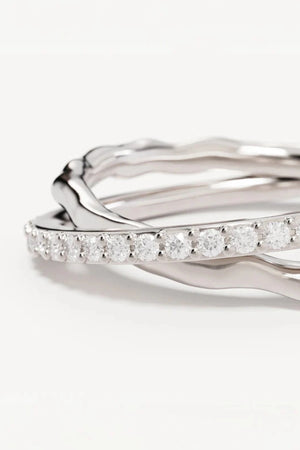 Entwined Hearts Ring by By Charlotte — a sterling silver double-band ring with intertwined crystal details, perfect for timeless everyday wear.