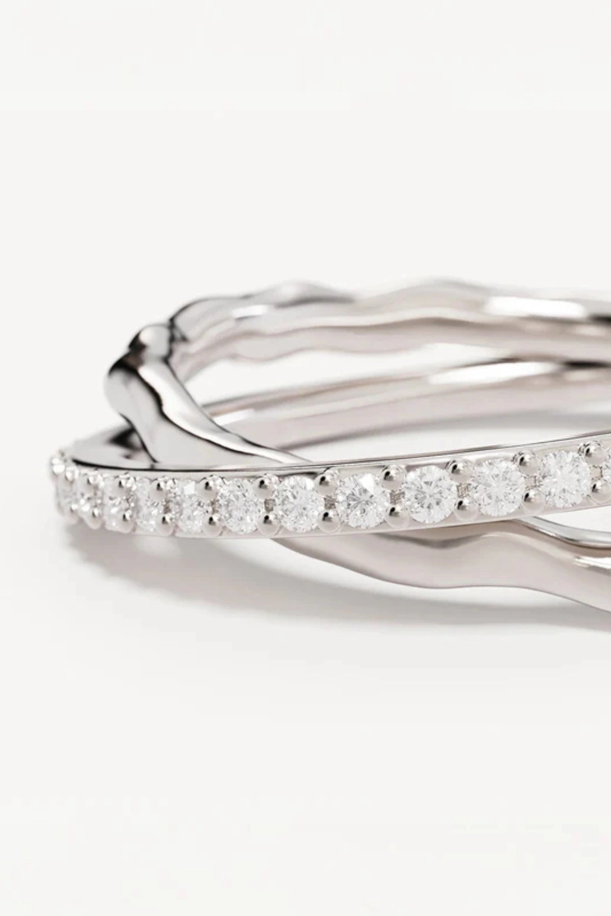 Entwined Hearts Ring by By Charlotte — a sterling silver double-band ring with intertwined crystal details, perfect for timeless everyday wear.