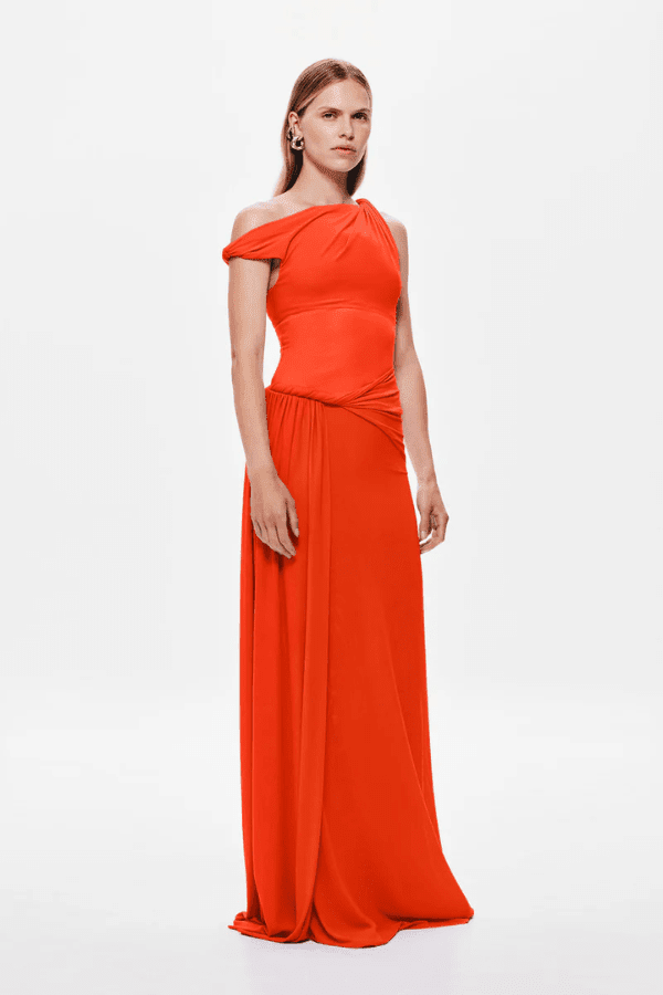 Sisal Mesh Dress Chilli by Misha – Trendy flowing maxi with twisted off-shoulder, sheer mesh bodice, and cascading sash, perfect for elegant day-to-evening wear and special occasions.