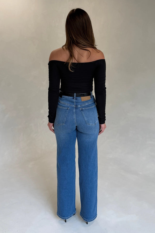 Celine High Rise Stretch Jean Indigo by Sneaky Link, high-stretch sculpting denim with a clean flare, elongating legs perfectly.
