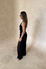 Christina Tank Black by Sneaky Link, sleek ribbed tank with scoop neckline and fitted shape. Perfect for effortless elevated basics.