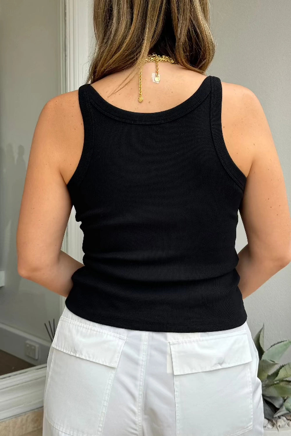 Isabella Tank Black by Sneaky Link – A sleek, versatile cotton blend tank with a deep V neckline. Perfect for chic desk-to-dinner outfits and everyday confidence.
