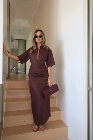 Lefka Midi Dress Chocolate by Sneaky Link – A trendy, breathable linen midi with flattering skirt tucks and button-front neckline, perfect for sunny lunches and relaxed summer days.