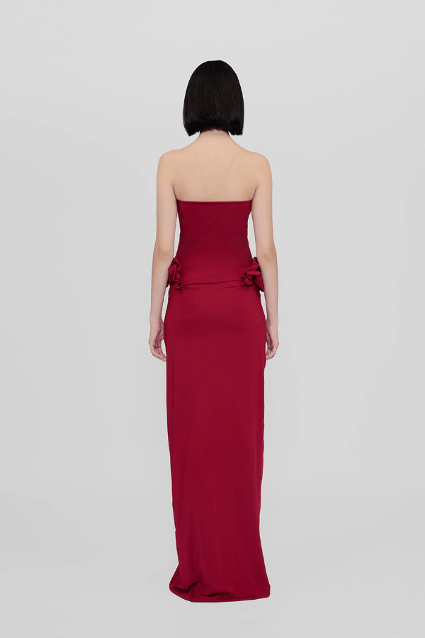 Calliope Dress Carmesi by Maygel Coronel – Strapless maxi dress with waist ruffles in iconic stretch fabric; bold, sleek, and sun-ready.