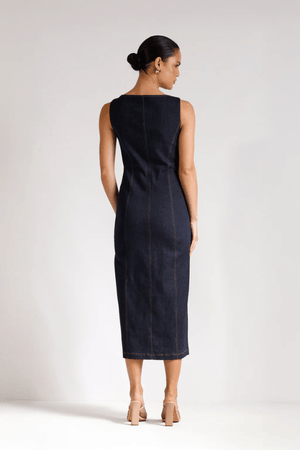 Good Vibes Midi Indigo by Pasduchas – Trendy stretch denim midi with contrast stitching, gold snaps, and tailored pockets, perfect for sleek day-to-night style.