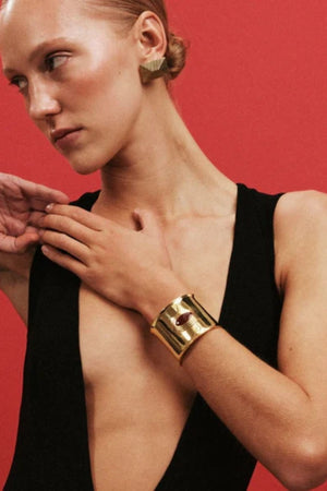 Matilde Cuff by Heaven Mayhem – a gold architectural cuff with deep burgundy enamel, perfect for bold refined styling.