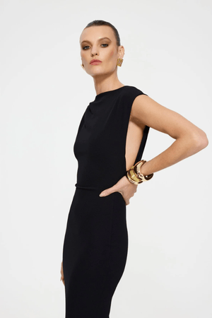 Audrey Gown Black by Effie Kats – A stretch-crepe gown with a straight neckline and dramatic low back, perfect for black-tie affairs, red carpet moments, or elegant evening events.