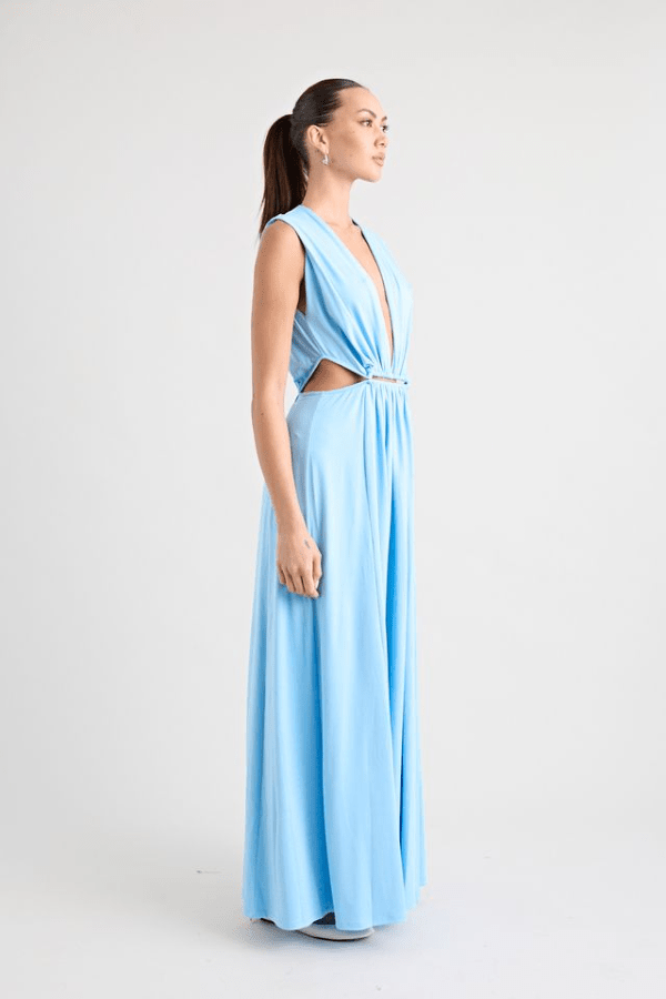 Do For Love Gown Light Blue by Pfeiffer – A trendy, elegant maxi with a deep plunge, thigh-high split, and bold hardware, perfect for special occasions and evening events.