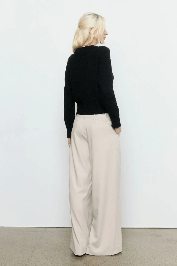 Allure Cardigan Black by Sovere Studio – Breathable 100% cotton knit with crew neck, button front, dropped shoulders, and ribbed details. Relaxed fit, perfect for layering.