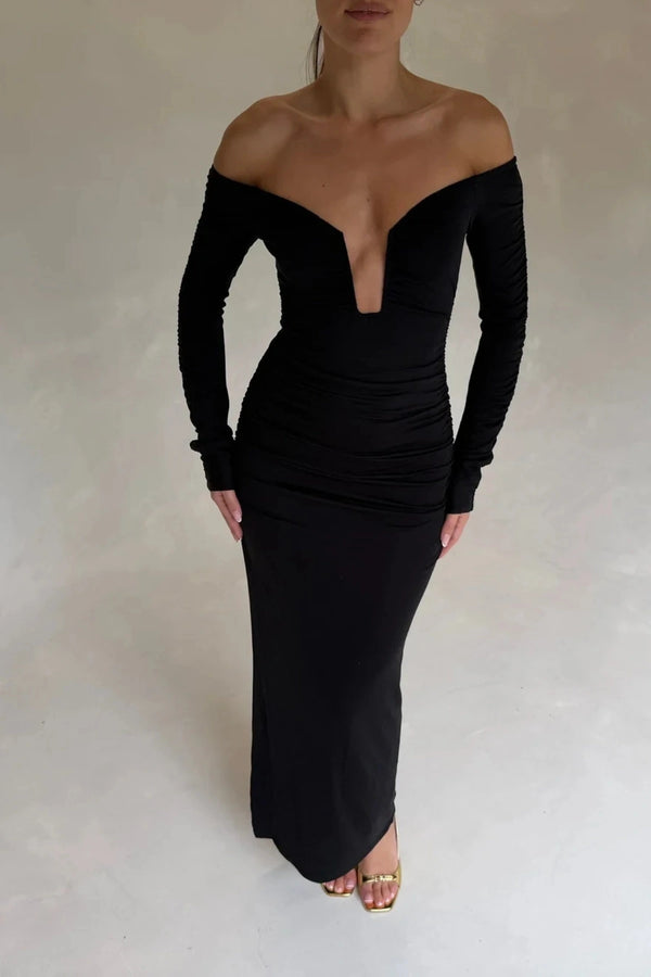 Black Haley off-shoulder midi dress with fitted bodice and flowy skirt, featuring short sleeves and a subtle slit.
