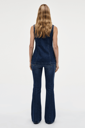Milla Zip Tunic Dark Indigo by Neuw Denim, trendy slim-fit denim vest with a double-ended zipper for adjustable styling. Perfect for a modern or '70s-inspired look, crafted from rigid denim that molds to your body over time.