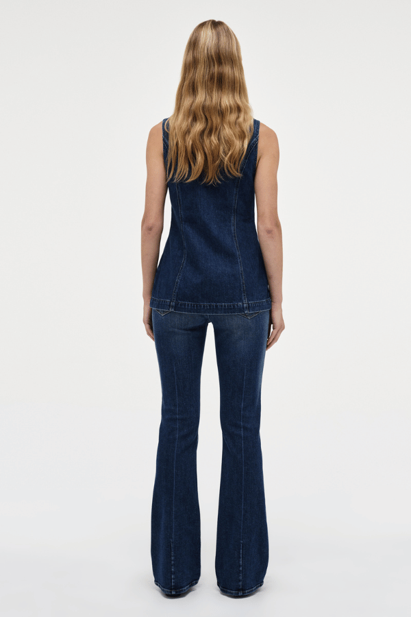 Milla Zip Tunic Dark Indigo by Neuw Denim, trendy slim-fit denim vest with a double-ended zipper for adjustable styling. Perfect for a modern or '70s-inspired look, crafted from rigid denim that molds to your body over time.