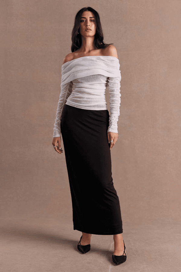 Emara Sleeveless Mini Dress Black by Sovere – fitted mini dress with pleats, keyhole neckline, tie details, and back zipper.