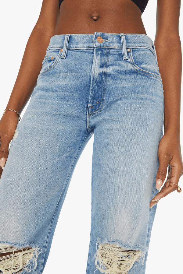 Mid Rise Maven Sneak Peak A Boo by Mother Denim, mid-rise relaxed wide-leg jeans with distressed knees, light-blue wash, perfect for casual cool style.