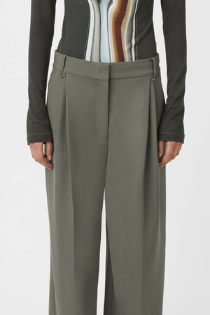 Annick Pant Sacramento Green by Camilla and Marc, double-pleated with a mid-low waist and pressed creases, perfect for modern tailoring or chic office dressing.