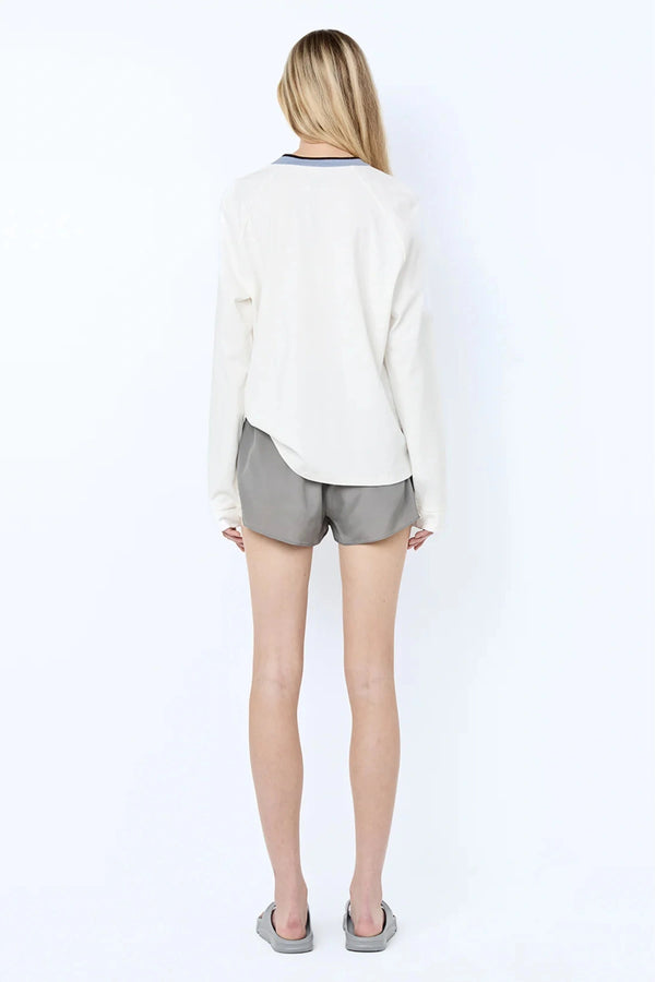 Chateau Short by Bec + Bridge, a luxe silk-viscose mini with lace detail and tie waist. Perfect for styling with matching tops.