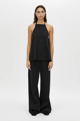 Canova Apron Top by Camilla and Marc, a black jersey apron-style tank with tie-back straps, side splits and embroidered hem.