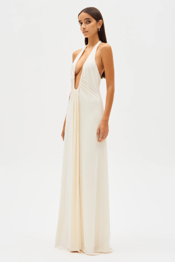 Jennifer Cupro Maxi Dress Ivory by Misha – A sleek and sophisticated maxi with a plunging halter neckline and dramatic sash, perfect for elegant day-to-night events.