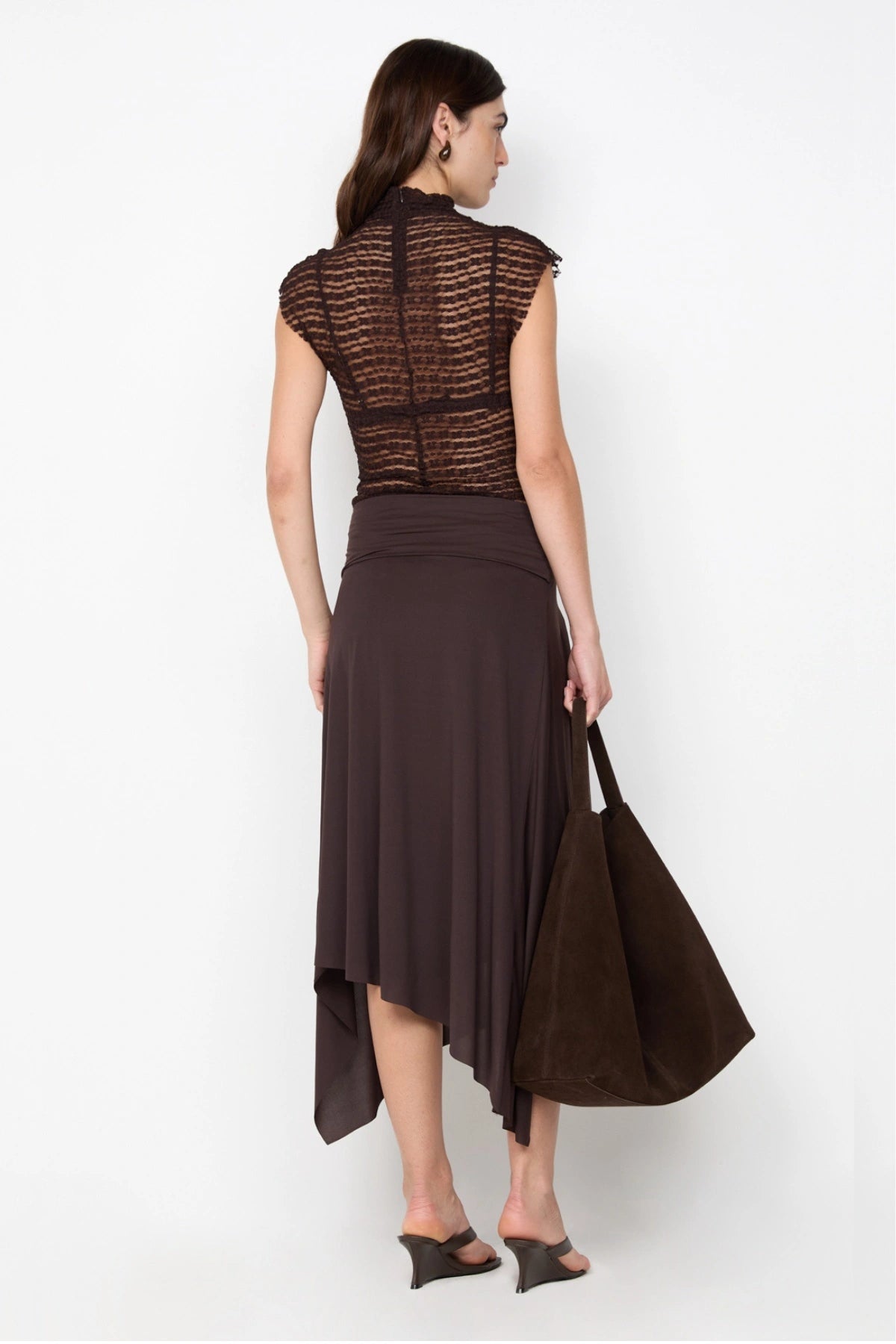 Asym Midi Skirt in Dark Chocolate by Bec + Bridge, designed with a draped silhouette and asymmetric hem for an effortlessly chic look.