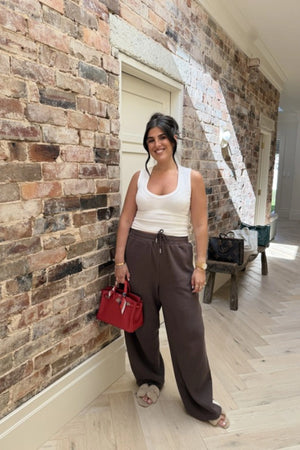 Chocolate Knitted Baggy Pants by Something Very Special, featuring stripe jacquard and tonal embroidery. Unisex comfort redefined.