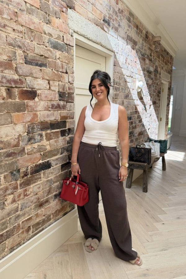 Chocolate Knitted Baggy Pants by Something Very Special, featuring stripe jacquard and tonal embroidery. Unisex comfort redefined.